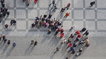 crowd of people in center of town, top view  